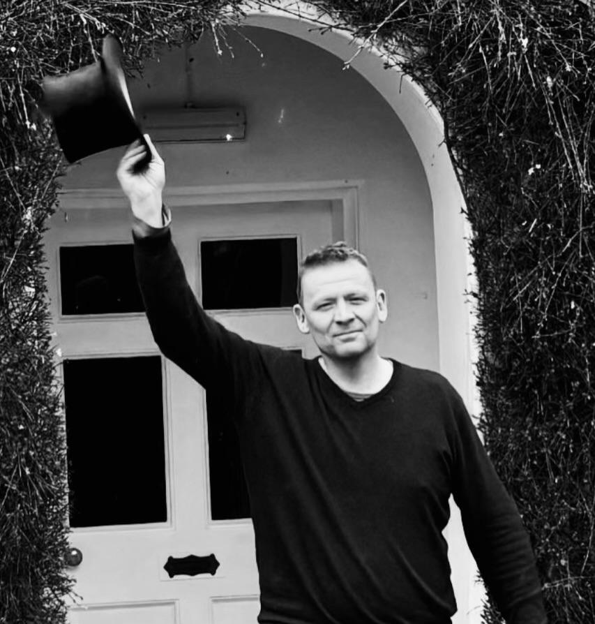 Christopher Wordsworth Andrew at the door of Rydal Mount, holding William Wordsworth's top hat